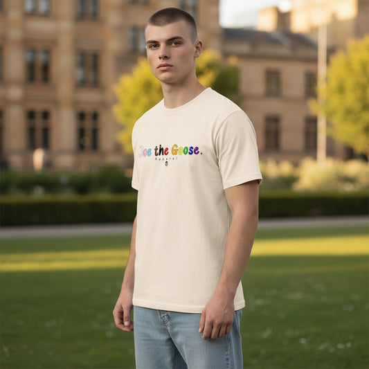 Man wearing a Joe the Goose Apparel cream cotton t-shirt with Pride Colours Goose logo outdoors.
